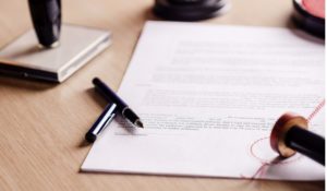 image of a signed document for a blog about Rowland Brothers International repatriation services