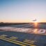 Plane landing during sunset