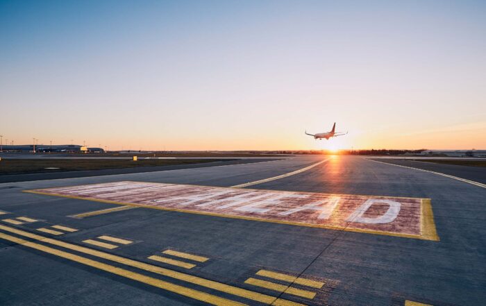 Plane landing during sunset