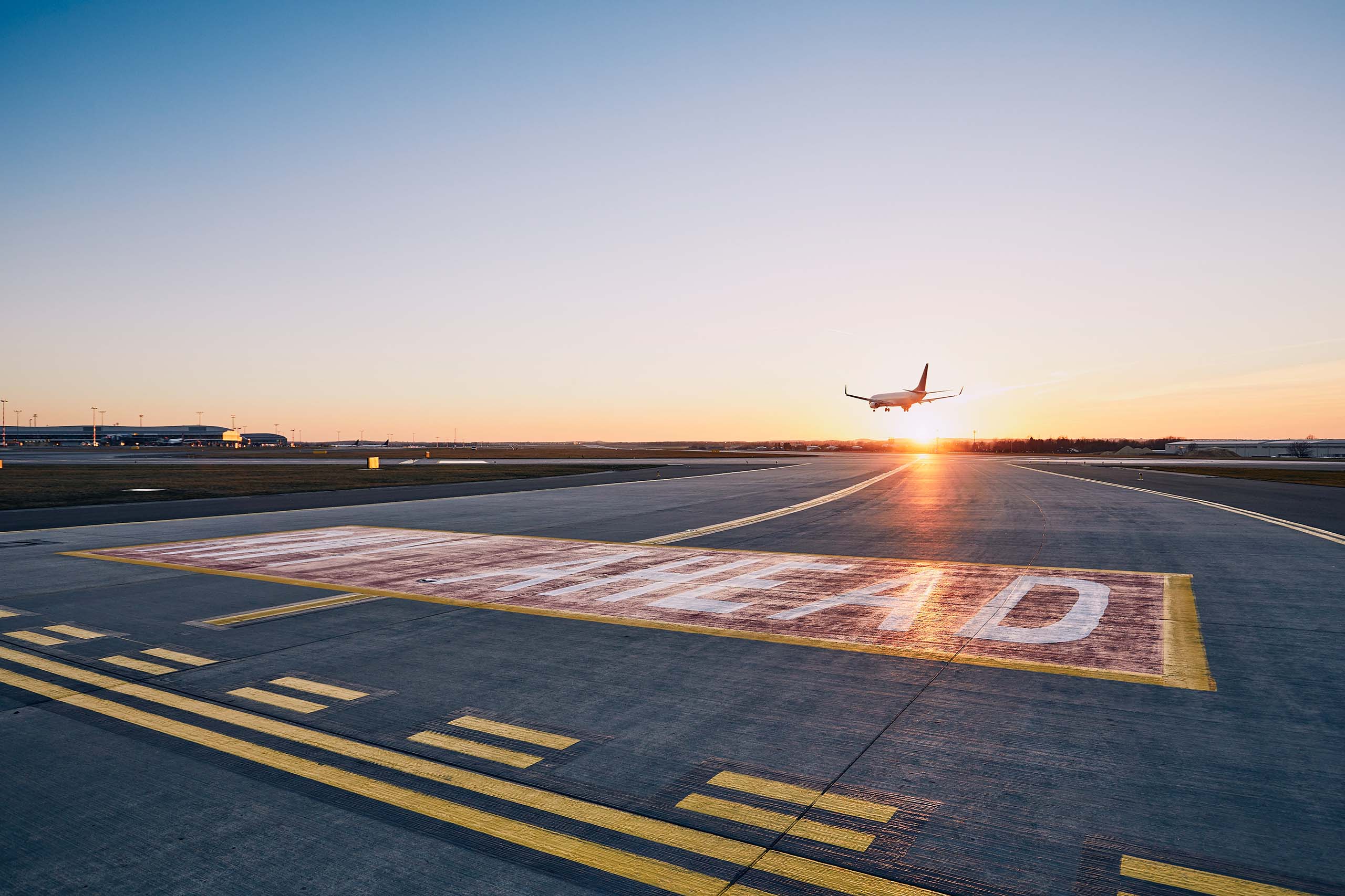 Plane landing during sunset